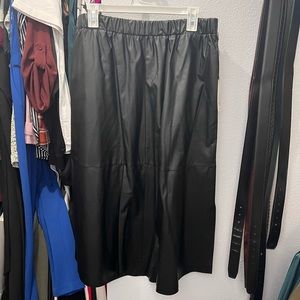Black, pleather midi skirt. Size: L. Never been worn.